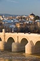 The Puente Romano (bridge) is an extremely old structure which was built during the time of the Romans under Augustus to span the Rio Guadalquivir. Located in the city of Cordoba, it is now a UNESCO World Heritage Site.