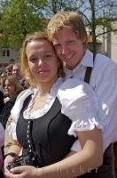 A traditionally dressed couple enjoy the celebrations of the Maibaumfest in Putzbrunn, Germany.