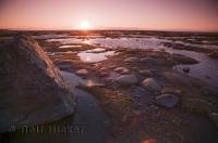 A magnificent place to spend an evening watching the sunset during a vacation in Quebec is on the shores of the St Lawrence River.
