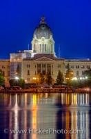 A view across Wascana Lake at the Saskatchewan Legislative Building at night in the city of Regina, the province of Saskatchewan, Canada. The building, built between 1908 and 1912 serves as the seat of the Legislative Assembly of Saskatchewan.