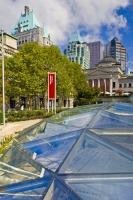 The glass roof of Robson Square is in stark contrast to the stately buildings, such as the Vancouver Art Gallery and the Fairmont Downtown Vancouver Hotel, nearby.