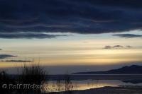 A serene picture of Great Salt Lake during a vivd sunset in Utah, USA.