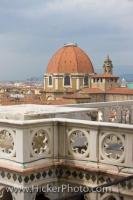 The San Lorenzo Church dome, as seen from the Duomo Campanile (bell tower), backdropped by the blue skies surrounding the city of Florence, Italy.