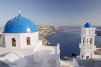 A beautiful church in the village of Imerovigli, Santorini overlooks the Aegean Sea in Greece.