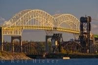 The International Bridge seen from the Soo Locks with the sunlight emitting a golden hue to the bridge as it spans the St. Mary's River in Sault Ste Marie in Ontario, Canada.