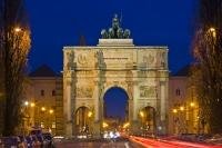 The Siegestor, also known as the Victory Gate, is a historic landmark situated in a busy area in Munich Germany as can be seen with the flowing traffic. The gate was built in 1852 and sustained some damage during bombing in WWII.