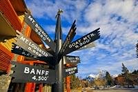 A multi-directional sign points out the mountains and their heights in the Town of Banff, Alberta, Canada.