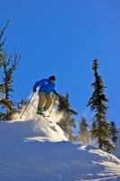 A skier gives a demo of the kind of action available when skiing on Whistler Mountain in BC, Canada.