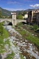 The stone bridge spans the Bevera river in the town of Sospel
in Provence, France in Europe.