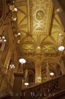 Golden and yellow colors highlight the interior of the stunning architecture of the Staatsoper Theatre in downtown Vienna, Austria.