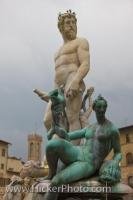 The Statue of Neptune surrounded by other ocean deities in the Piazza della Signoria in the city of Florence, Italy is one of many works of art in this outdoor museum which is a popular tourist attraction.