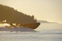 A late summer sunset as the Coast Guard heads out on a mission into Johnstone Strait, BC, Canada.