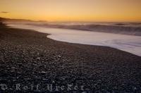 Situated 22 kilometres west of the Fox Glacier townsite, the gravely shores of Gillespies Beach face the Tasman Sea coastline on the West Coast of the South Island of New Zealand.