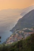 The tiny village of Riomaggiore perched on the side of a cliff in the National Park Cinque Terre in Liguria, Italy.