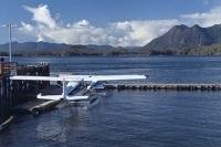 Float planes moored at the Tofino Harbour on the west coast of Vancouver Island in British Columbia, Canada.