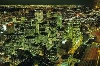 From the CN Tower you can see the entire downtown core of Toronto, Ontario illuminated during the evening with night lights.