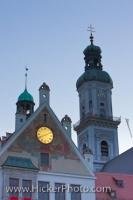 The facade of the Town Hall in Freising, Bavaria in Germany, is backed by the 17th century bell tower of Saint Georges Church.