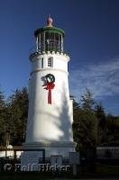 The sun shines off a christmas wreath decorating the Umpqua River Lighthouse in Oregon, United States.