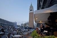 Seats fill the area of the Caffe Florian in the Piazzo San Marco in Venice as musicians play for the people that want a real taste of Italy.