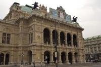 The grand Vienna Opera House, the Staatsoper adorned with statues in downtown Vienna, Austria.