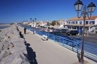 Saintes Maries de la Mar in the Parc Naturel Regional de Camargue in the Provence, France is a resort town where you can walk for miles along the scenic waterfront.