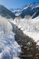 The winter scenery in the valley Wildgerlostal in Salzburger Land in Austria, Europe is picturesque with the river flowing between the snowy banks.