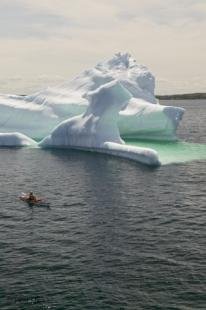 photo of kayaking with icebergs