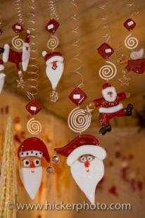 photo of Santa Hanging Christmas Ornaments