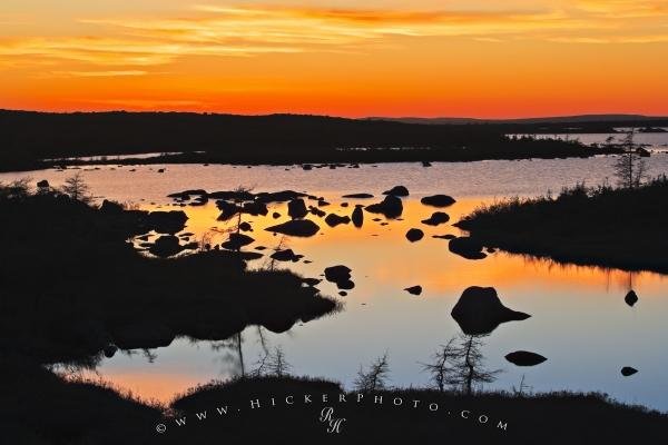 Photo of a sunset glistening off a pond between Red Bay and Mary's Harbour on the Labrador Coastal Drive in Southern Labrador. Photo: 
Tundra Sunset Southern Labrador