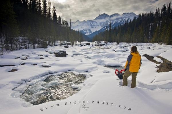 Photo of a woman enjoying the scenery of the Rocky Mountains in Banff National Park alongside the Mistaya River. Photo: 
Rocky Mountains Winter Scenery Banff National Park